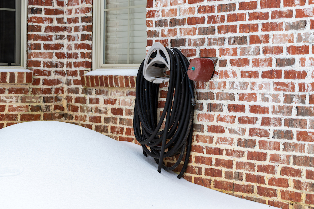 A covered faucet during winter months to prevent plumber frozen pipes.