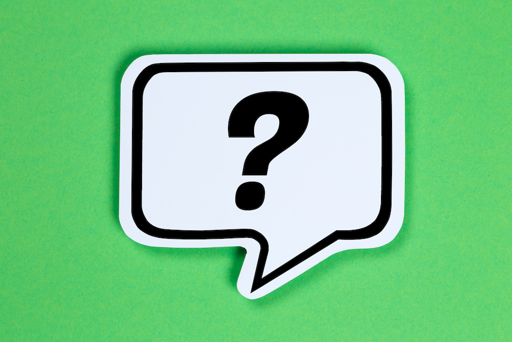 Black question mark on speech bubble with green background. | Plumbing Service