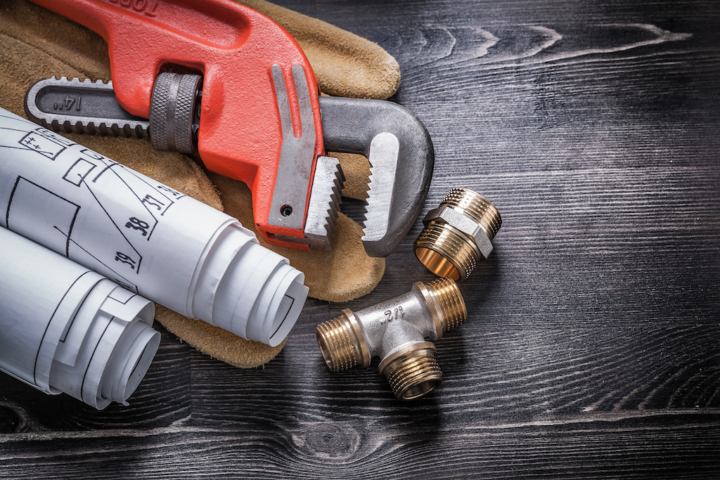 Pipe wrench and other plumbing tools. Plumbing services.