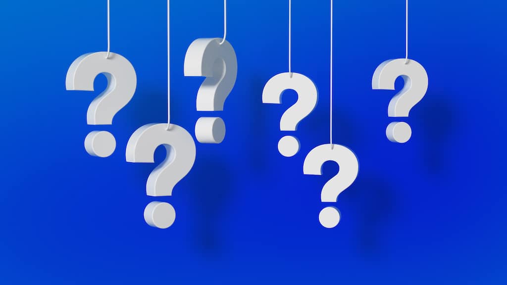 White question marks hanging from string on blue background. FAQs about Water Heater Expansion Tanks.